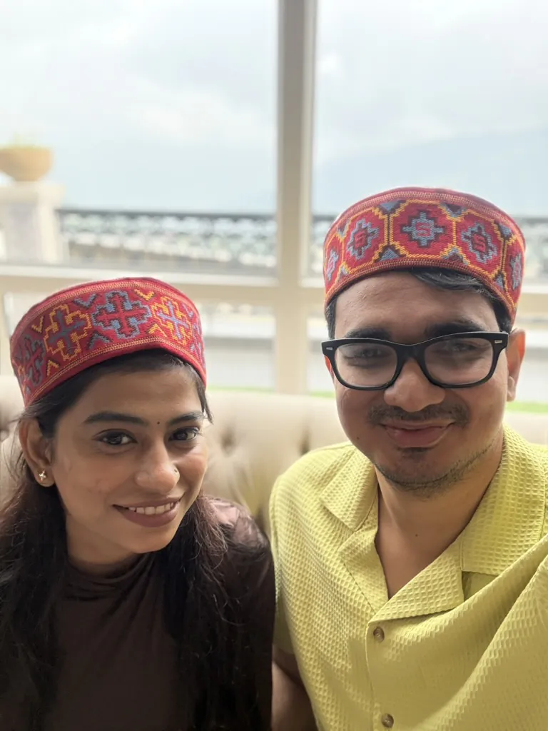 A selfie in matching Himachali caps